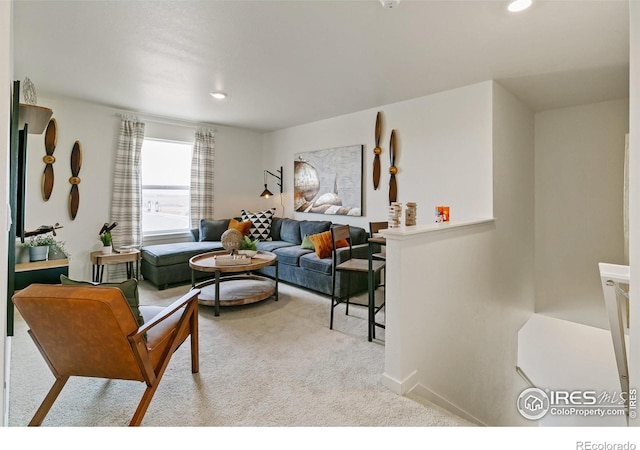 living room featuring light carpet