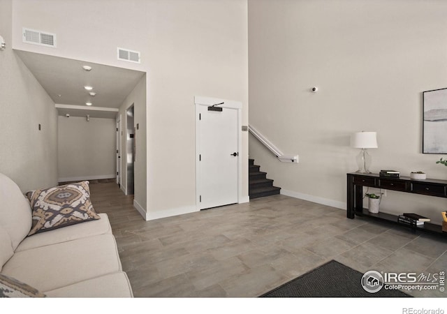 living room with a high ceiling