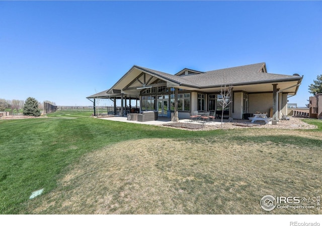 exterior space with a yard and a patio area