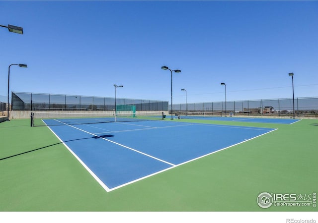 view of tennis court with basketball court