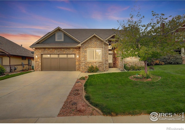 craftsman-style house with a lawn and a garage