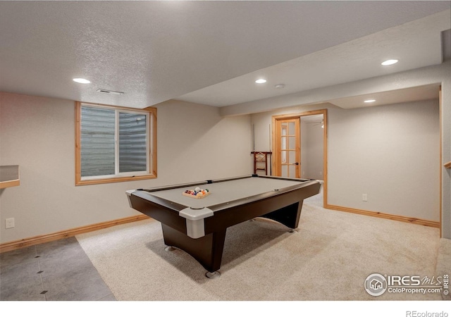 playroom featuring french doors, light colored carpet, a textured ceiling, and pool table