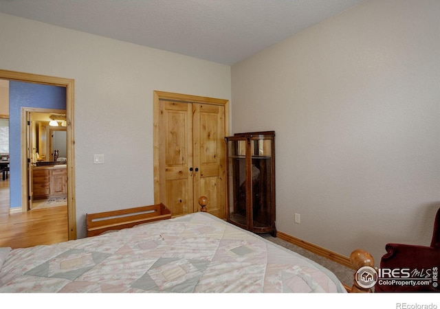 bedroom featuring ensuite bath