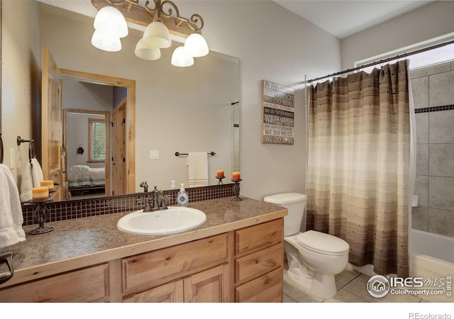 full bathroom featuring tile patterned floors, vanity, toilet, and shower / bath combination with curtain