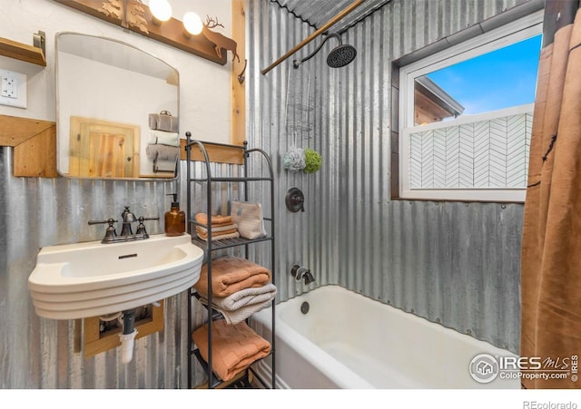 bathroom featuring sink and  shower combination