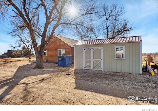 view of outbuilding featuring cooling unit