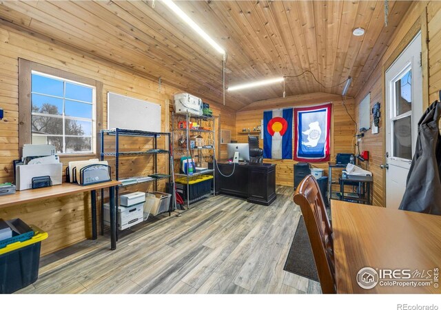 office space featuring wood ceiling, wood walls, hardwood / wood-style floors, and lofted ceiling