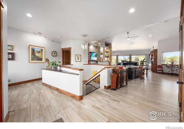 kitchen featuring light wood-type flooring and ceiling fan