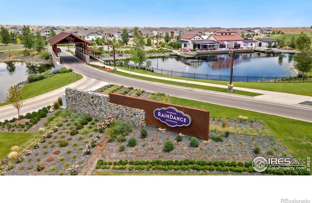 bird's eye view featuring a water view and a residential view