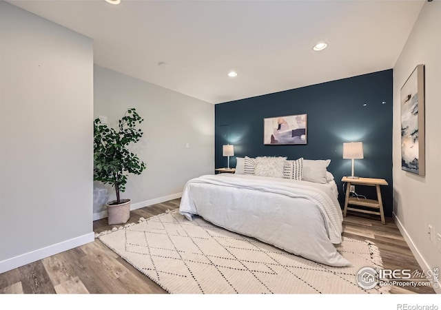 bedroom featuring hardwood / wood-style floors