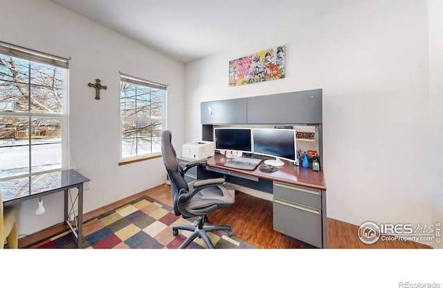 home office with dark wood-type flooring