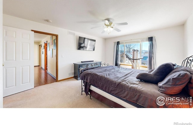 carpeted bedroom featuring ceiling fan