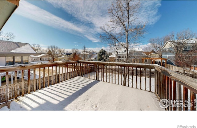 view of snow covered deck