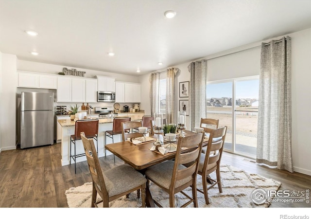 dining area featuring dark hardwood / wood-style flooring