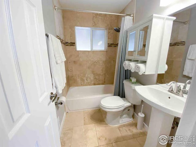 full bathroom featuring sink, tile patterned floors, shower / tub combo, and toilet