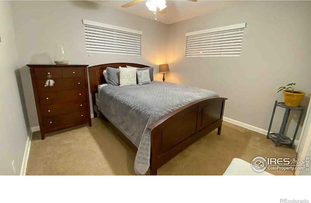 bedroom featuring light carpet and ceiling fan