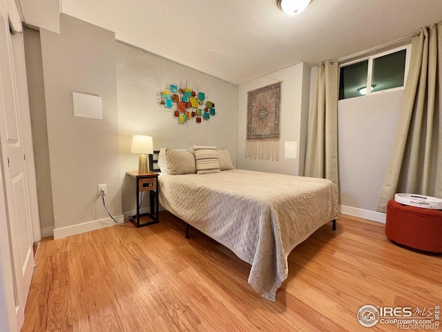 bedroom with light hardwood / wood-style floors