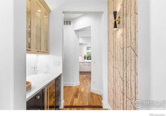 interior space featuring hardwood / wood-style flooring and wine cooler