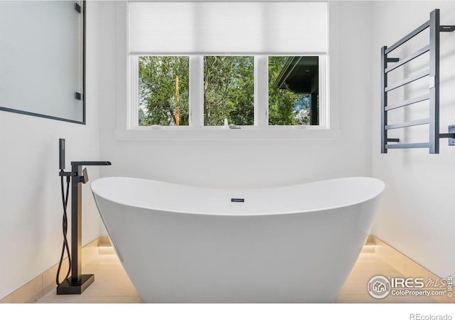 bathroom featuring a bathtub and radiator heating unit