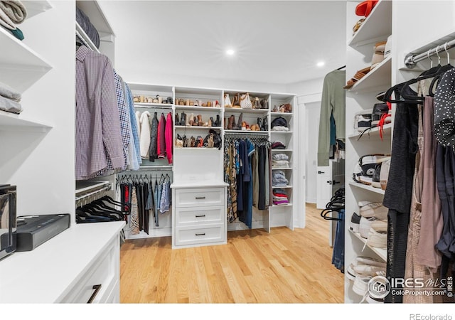 walk in closet featuring light hardwood / wood-style floors