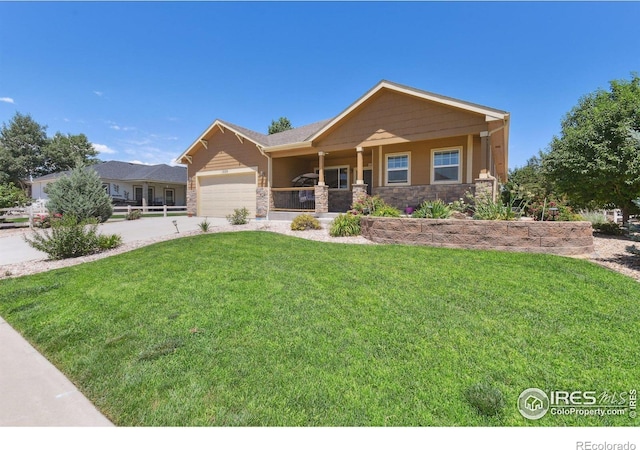 view of front of home with a garage and a front yard