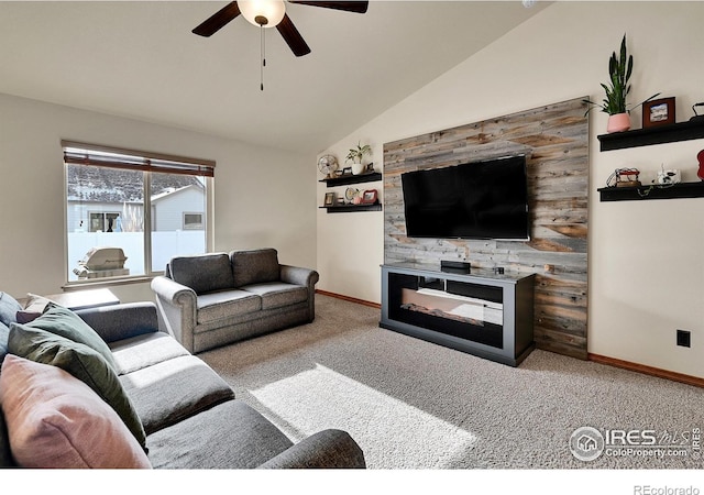 living room featuring ceiling fan, lofted ceiling, and light carpet