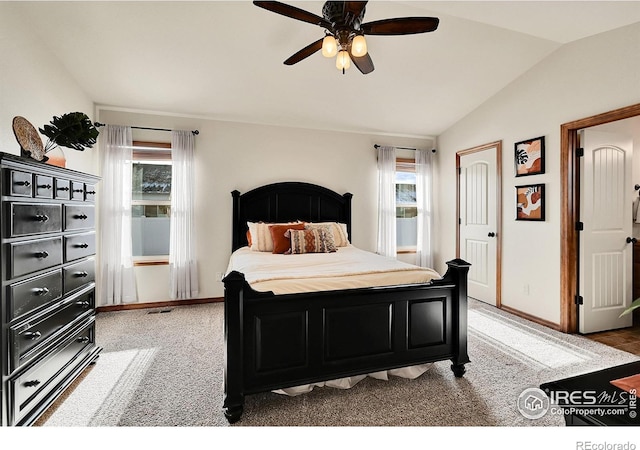 bedroom with carpet floors, vaulted ceiling, and ceiling fan