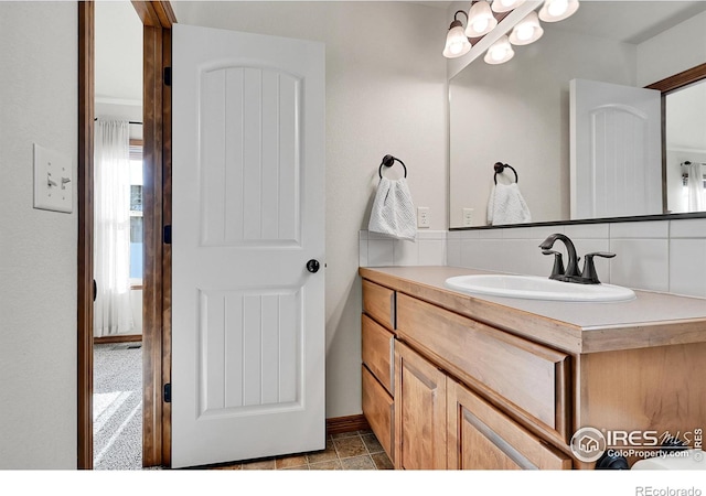 bathroom with vanity and backsplash