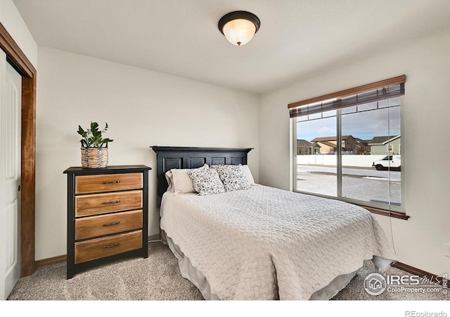 bedroom with light colored carpet