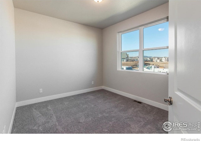 view of carpeted spare room