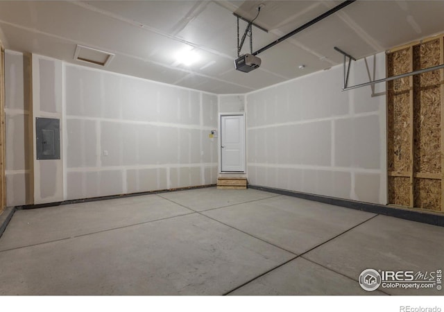 garage featuring a garage door opener and electric panel