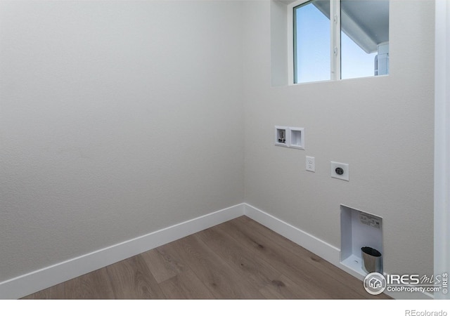 laundry room with hookup for an electric dryer, hookup for a washing machine, and hardwood / wood-style floors
