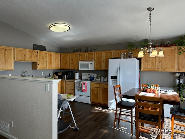 kitchen with white appliances, decorative light fixtures, dark hardwood / wood-style flooring, an inviting chandelier, and vaulted ceiling