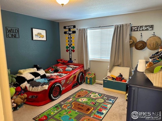 carpeted bedroom with a textured ceiling