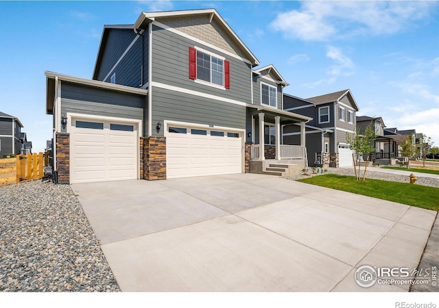 view of front of property with a porch and a garage