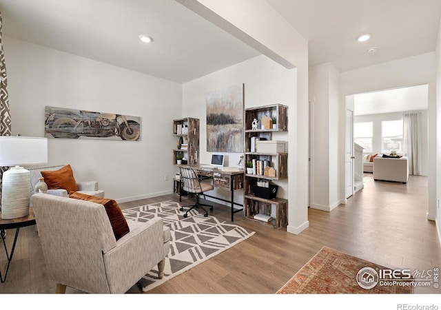 office area with hardwood / wood-style floors