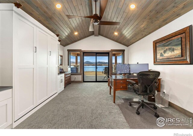 office featuring ceiling fan, lofted ceiling with beams, dark carpet, and wood ceiling