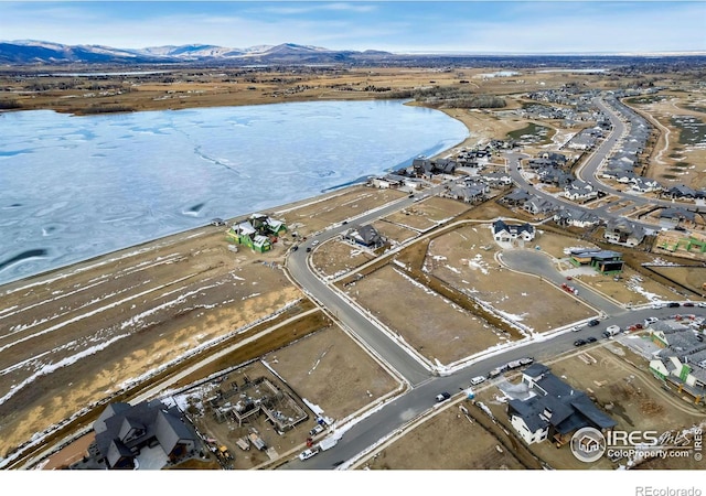 bird's eye view featuring a water and mountain view