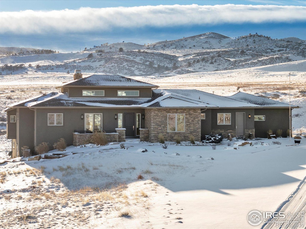 view of front of home with a mountain view