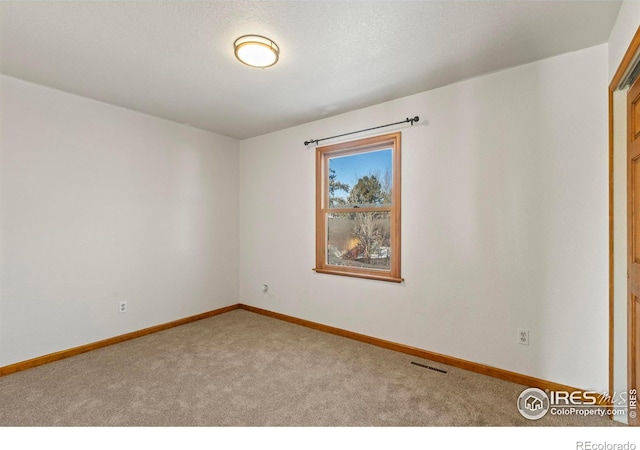 unfurnished room with carpet floors