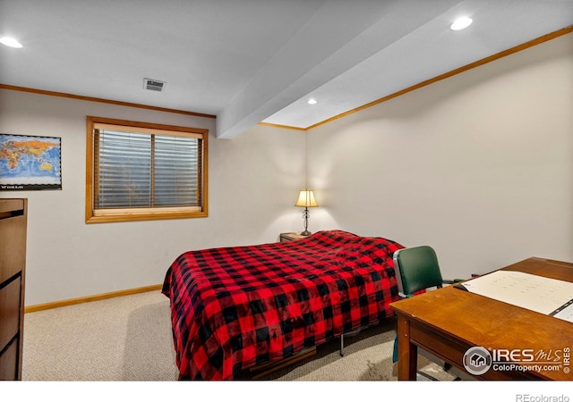 bedroom with ornamental molding, beam ceiling, and carpet floors