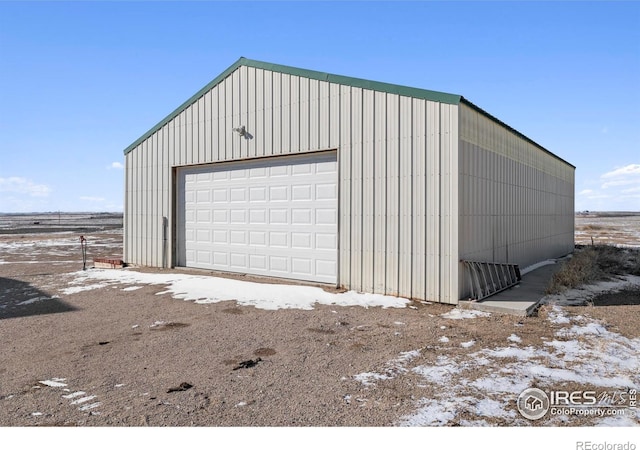 view of snow covered garage