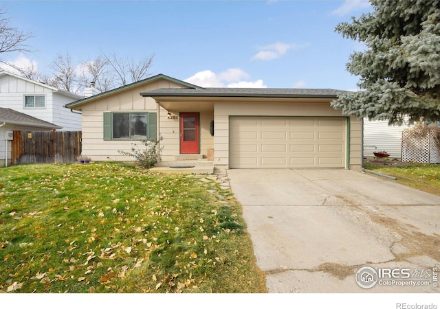 view of front facade featuring a garage and a front lawn