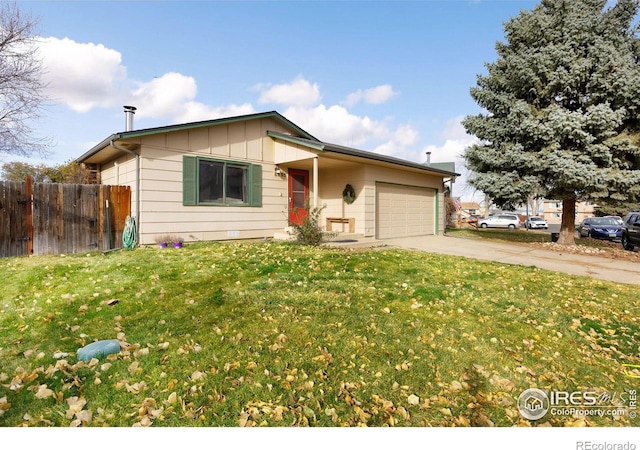 view of front of property featuring a garage and a front yard