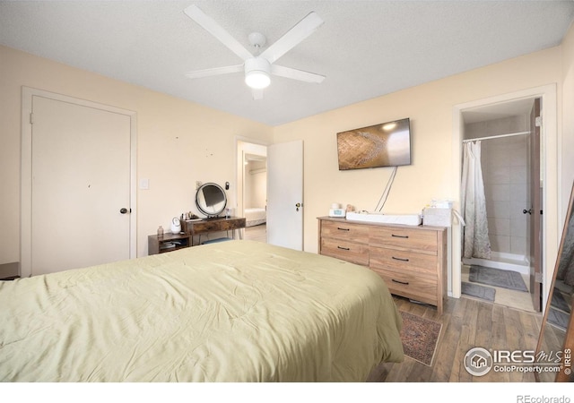 bedroom featuring ceiling fan, a textured ceiling, and ensuite bathroom