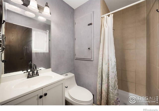 bathroom with vanity, toilet, and walk in shower