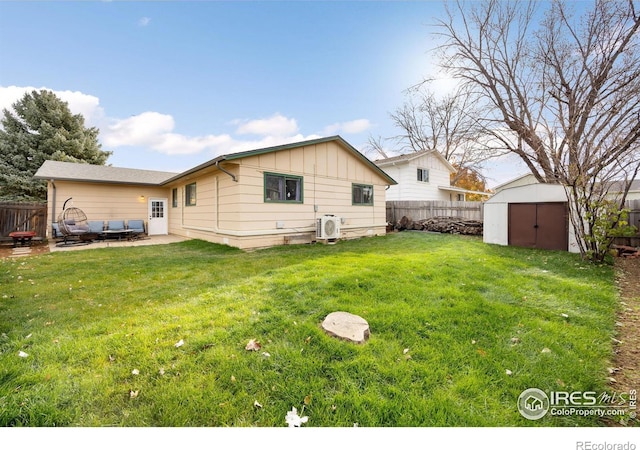 back of house with a patio, ac unit, a lawn, and a storage shed