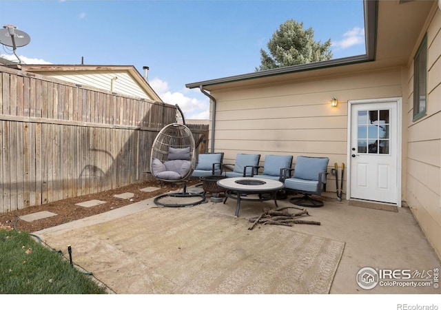 view of patio with a fire pit