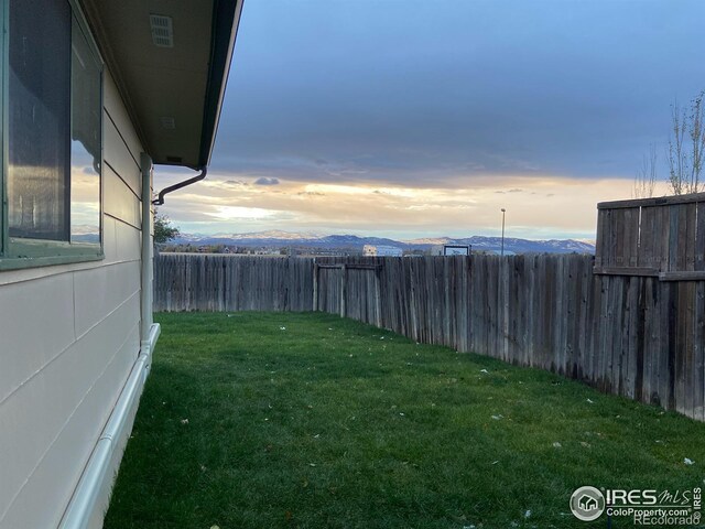 yard at dusk with a mountain view