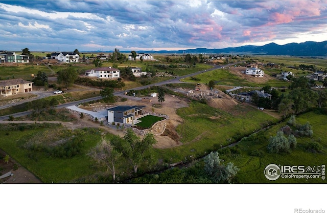 aerial view at dusk with a mountain view